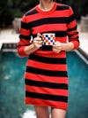 Woman holding blue and red checkerboard mug