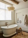 airy bathroom with freestanding tub