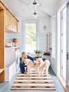 Woman in laundry room with dogs