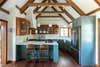 blue kitchen with a frame ceiling