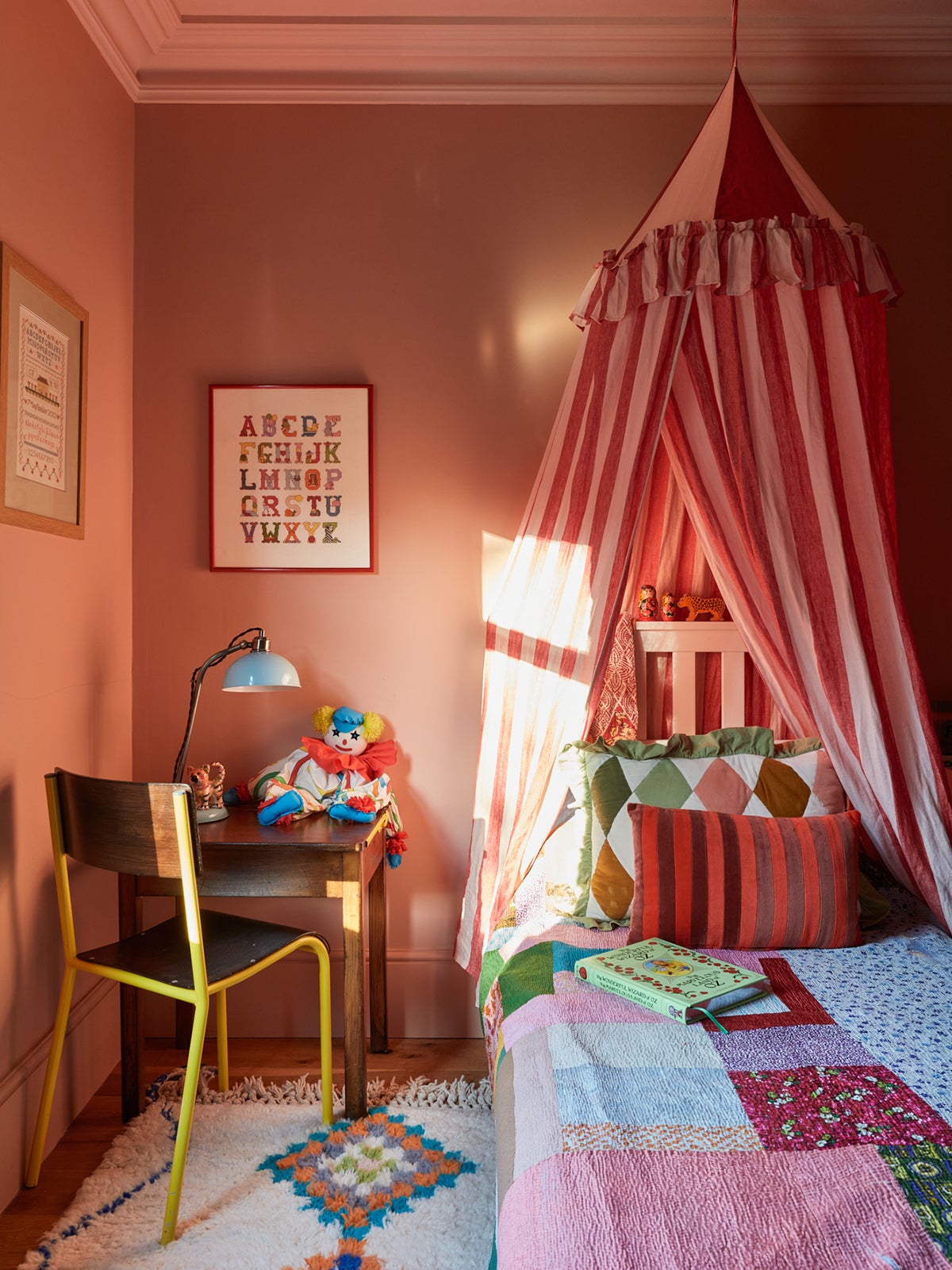 pink kids room with bed tent