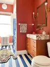 red bathroom with blue striped floors