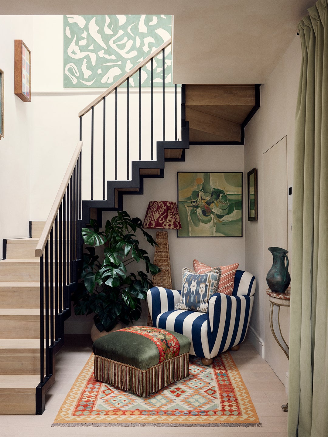 striped chair under stairs