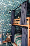 floral wallpapered bedroom