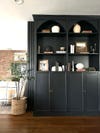 black cabinets with arched tops