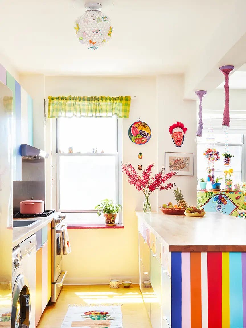 Colorful kitchen with stripes of paint on island