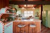 wood paneling and candy stripe kitchen