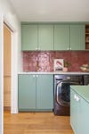green laundry room cabinets