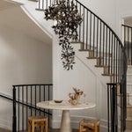 Staircase with tree chandelier