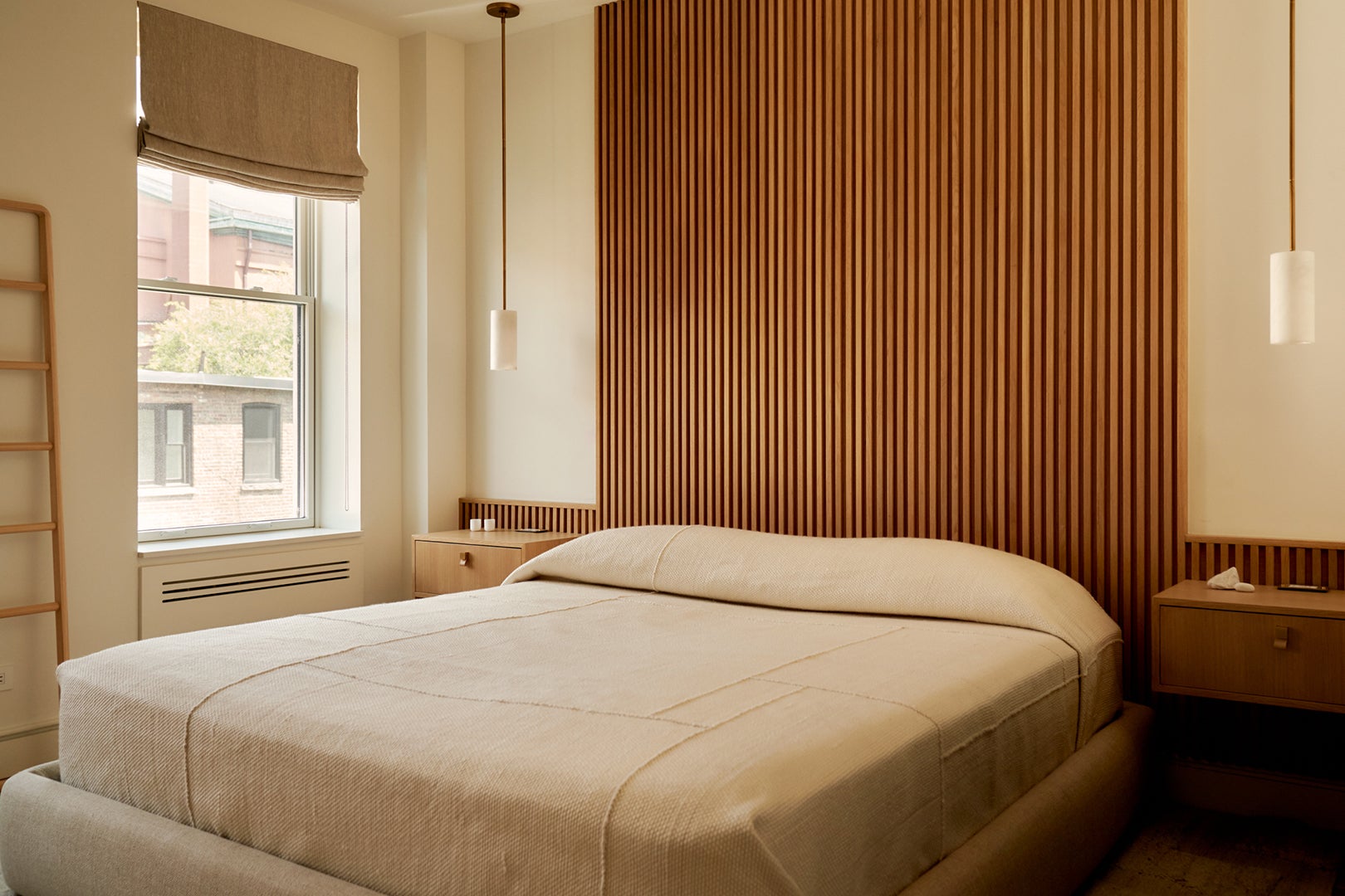 bedroom with wood slatted wall