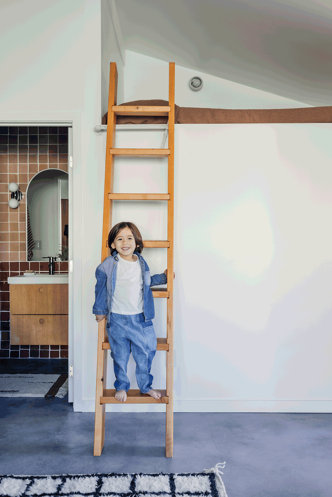 kid playing on ladder
