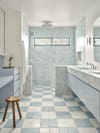 Bathroom with ice blue stone walls and checkerboard tiled floor. 
