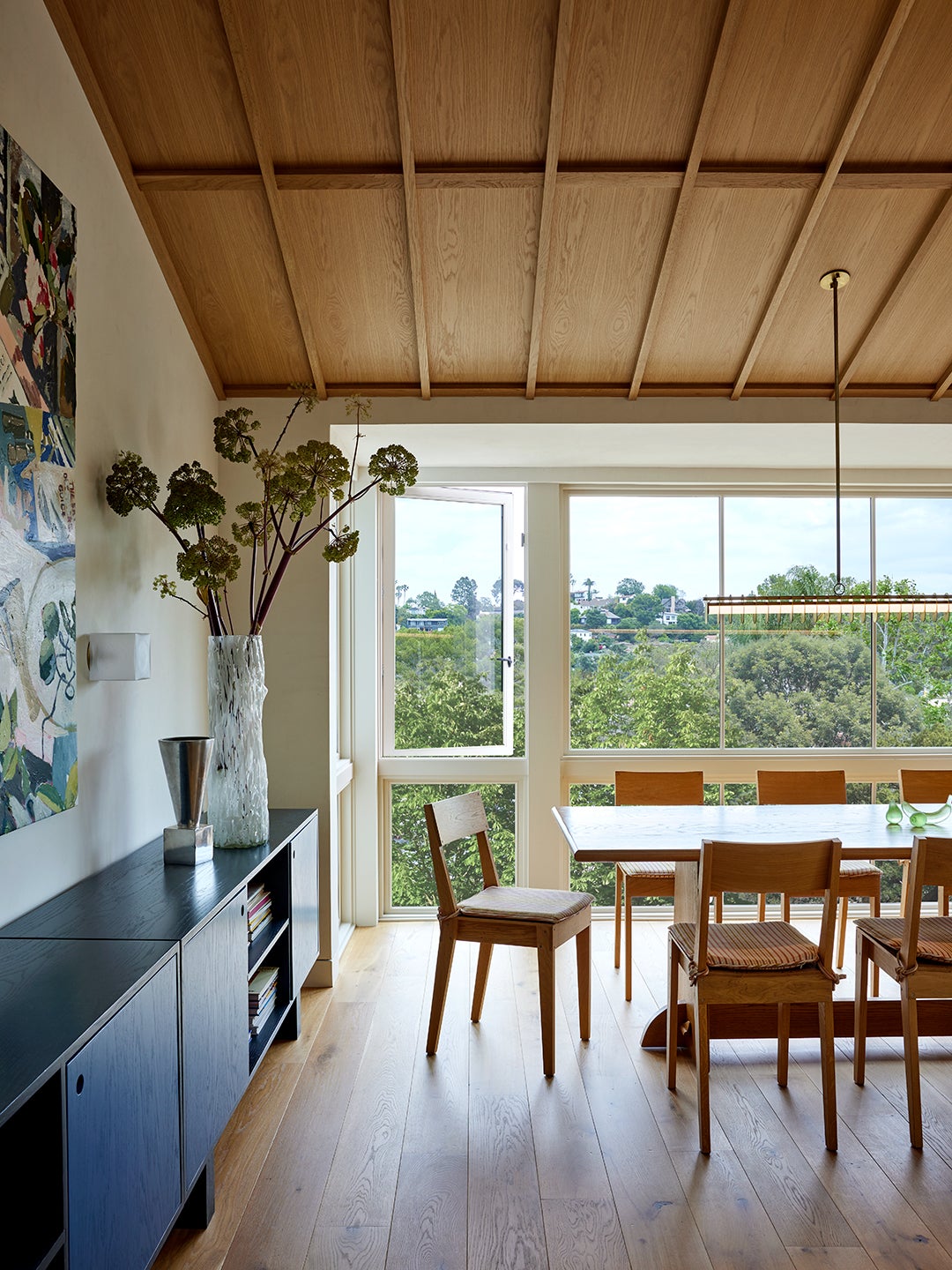 dining room with sloped wood ceiling