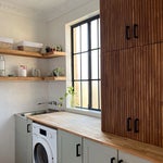 green laundry room cabinets