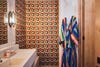 Bathroom with swirly tile walls