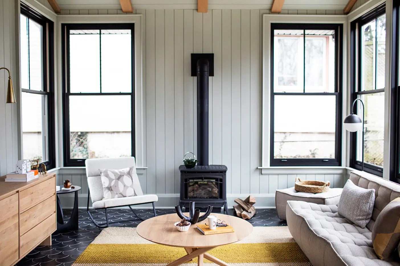 paneling living room with wood stove