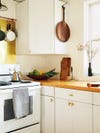 white cabinets with butcher block counters