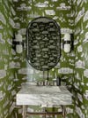 green wallpapered powder room