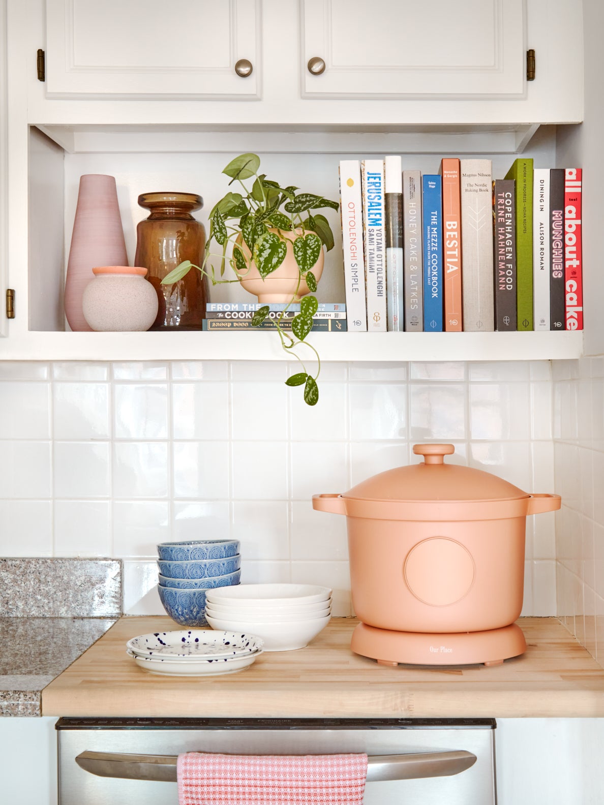 kitchen counter with pastel slow-cooker device