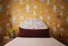 bedroom with whimsical yellow wallpaper