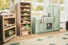 Playroom with sage kitchen and shelves for toy food