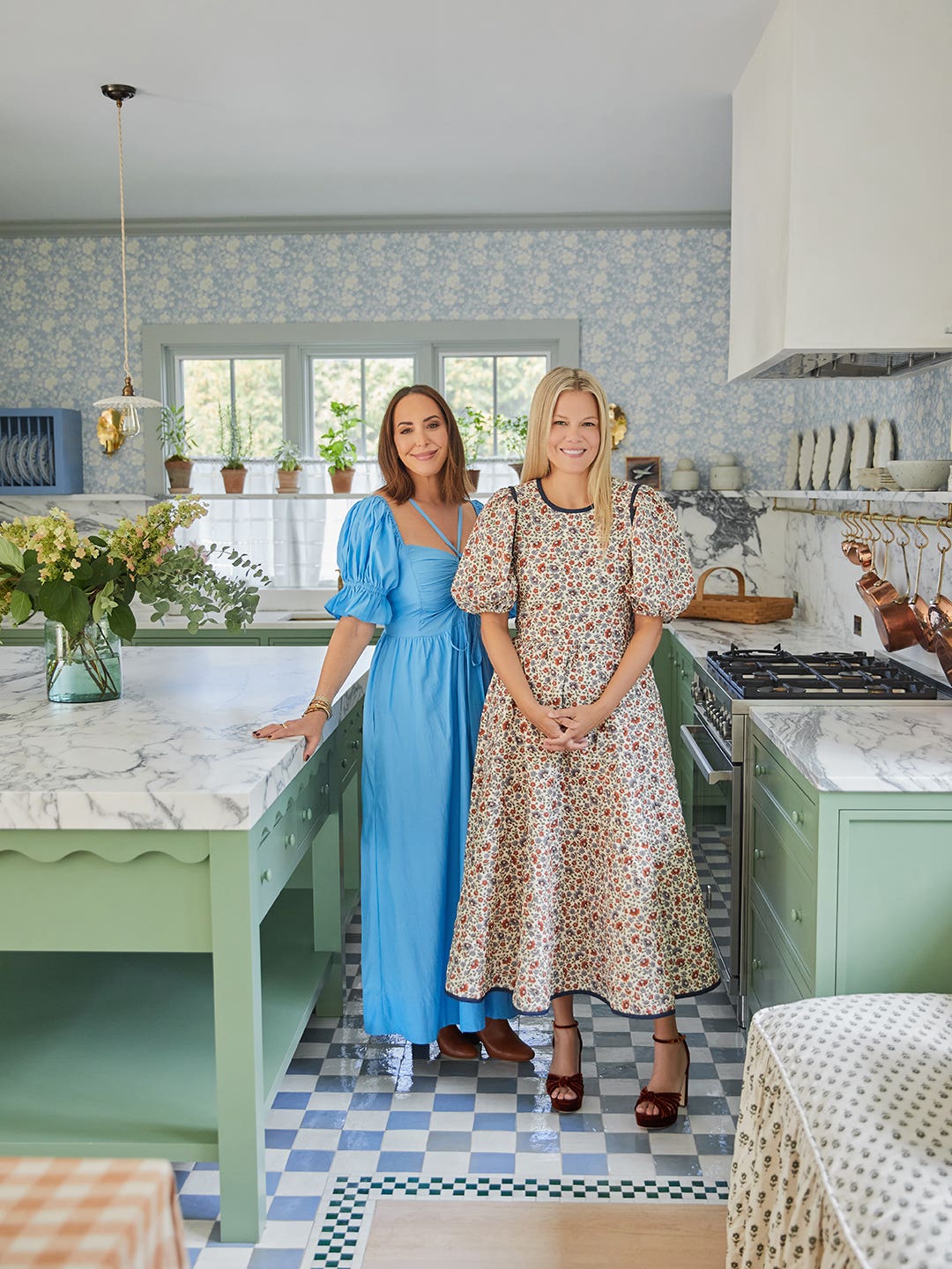 designer and owner standing in kitchen