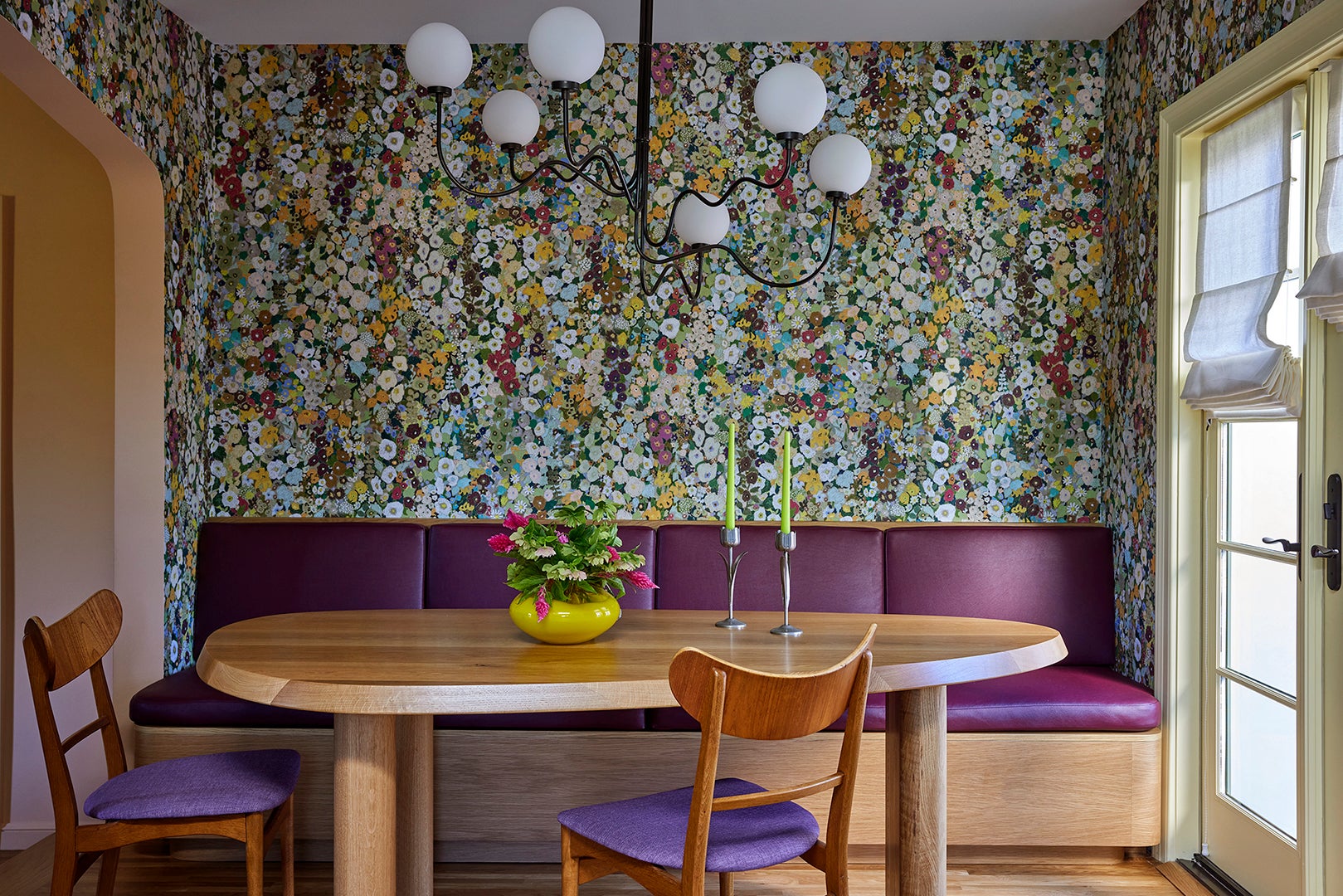 Dining room view of floral wallpaper and dining table