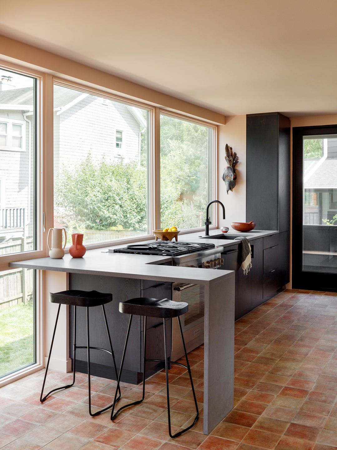 modern black kitchen with windows