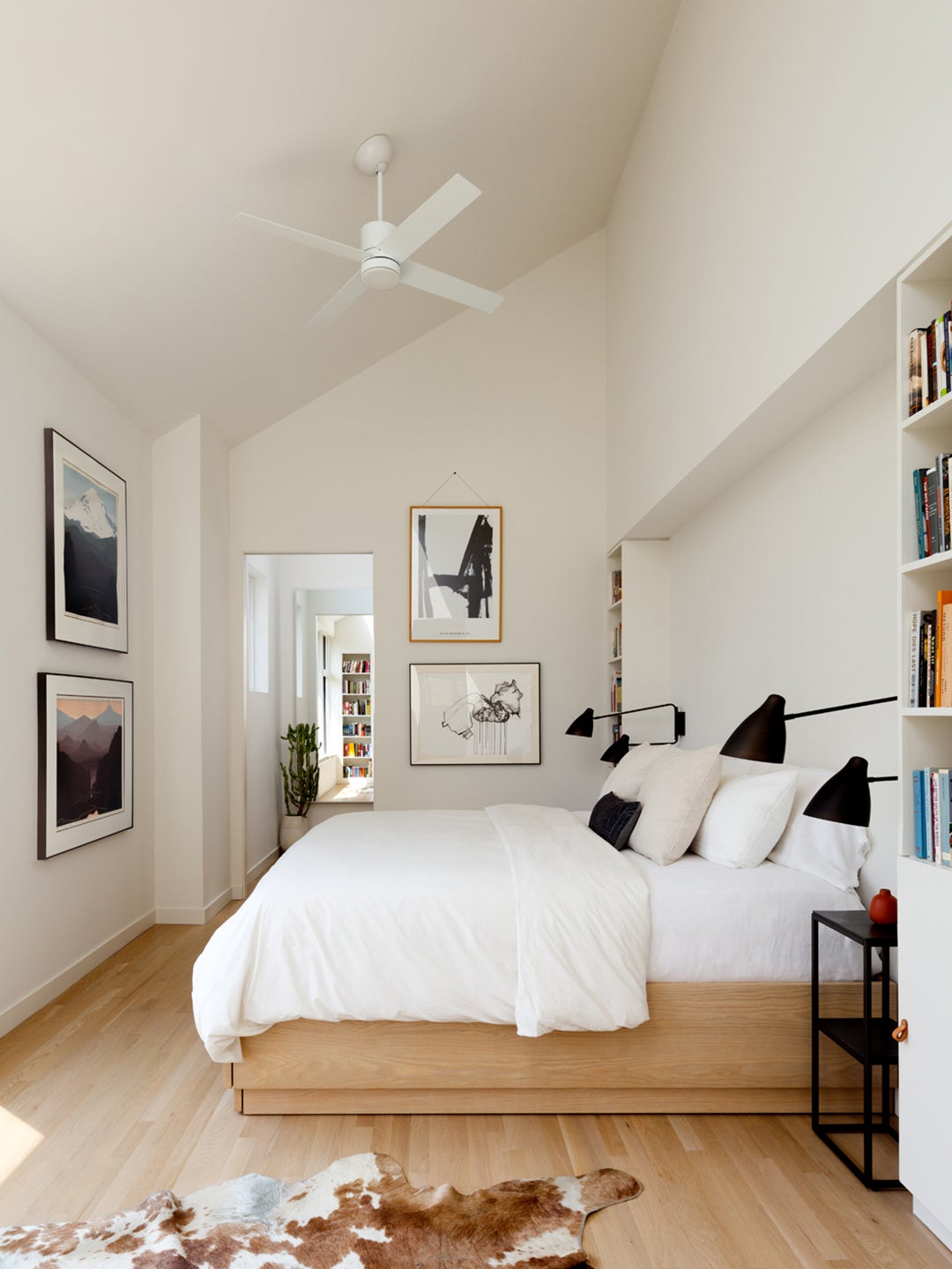 white bedroom with pitched ceiling