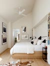white bedroom with pitched ceiling
