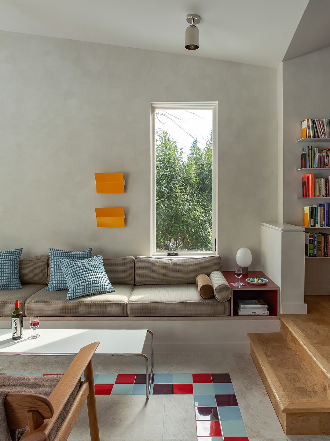 Living room with tile floor and slim vertical window