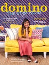 Mindy Kaling sitting on a yellow sofa with the word Domino over her head