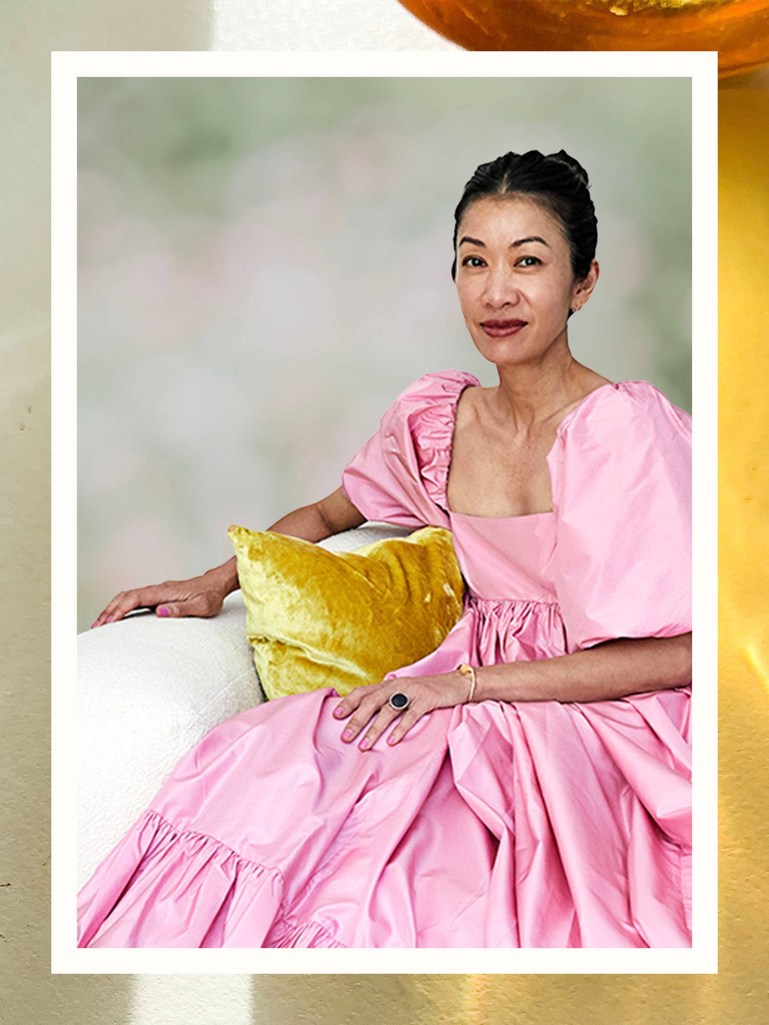 woman with yellow pillow and pink dress