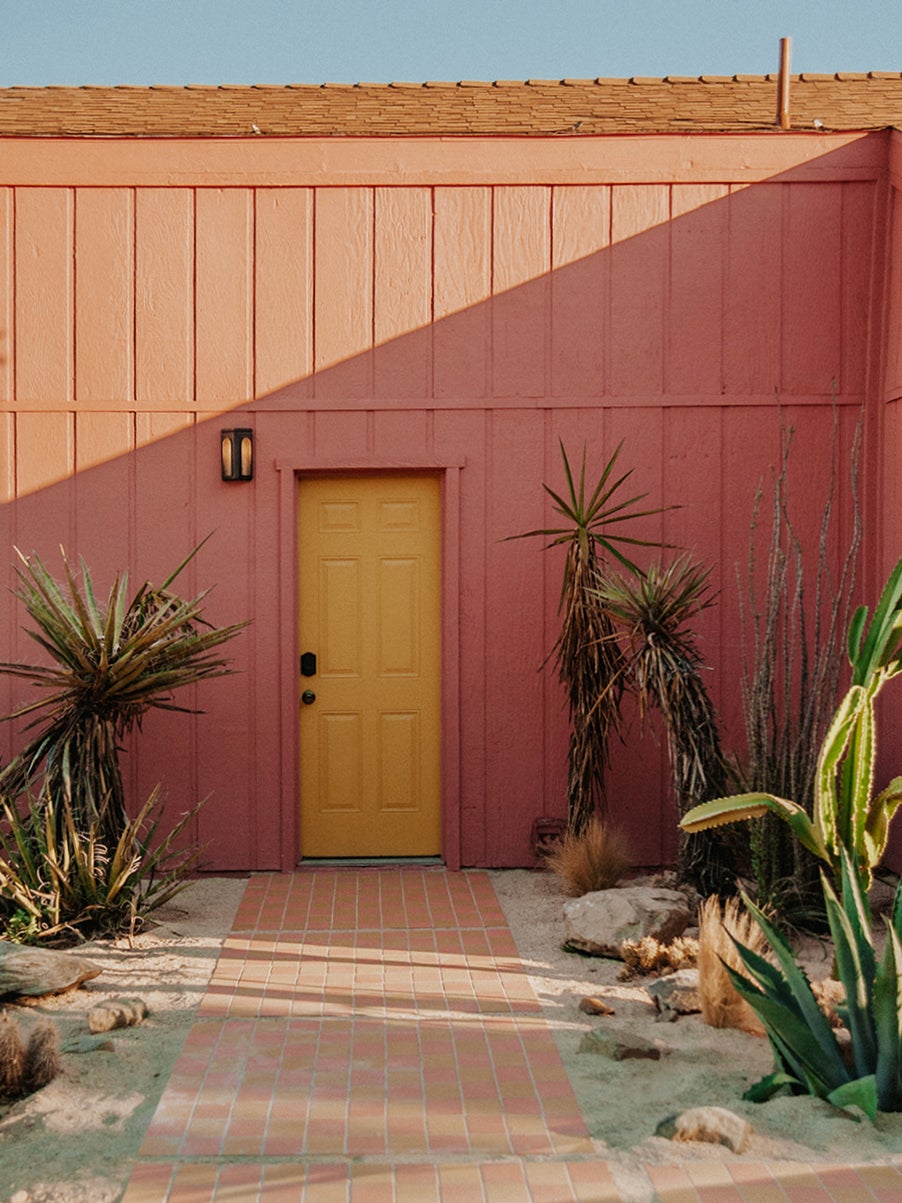 pink house with yellow door