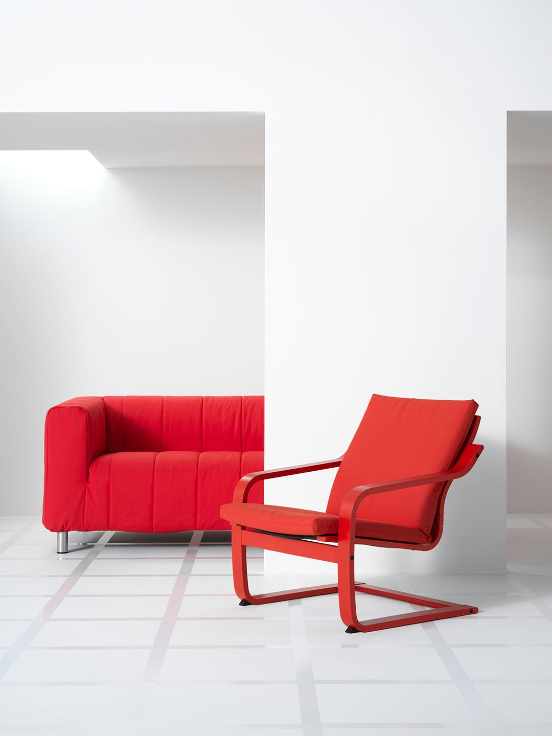 IKEA Klippan sofa and Poang chair in red