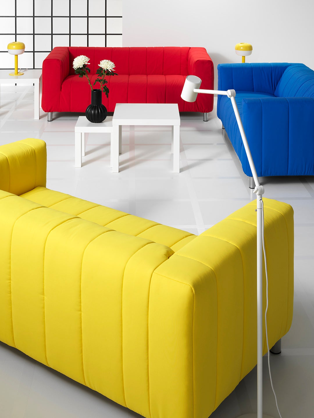 IKEA Klippan sofa in yellow, red, and blue