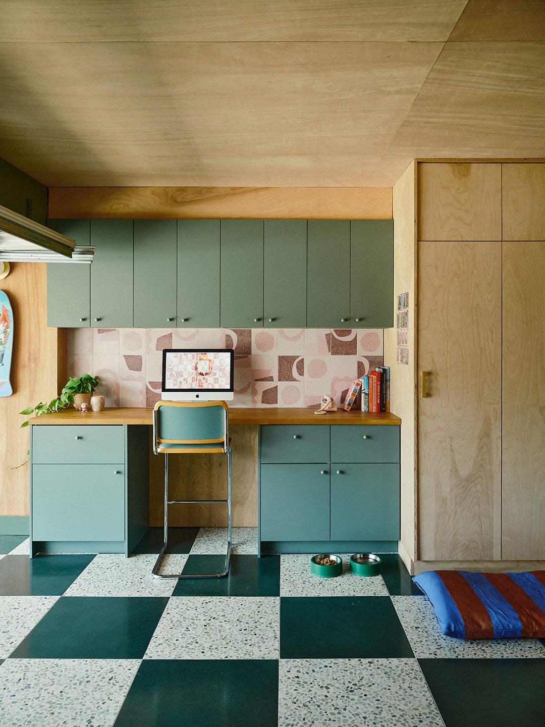 Green cabinets with a built-in desk