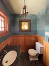 wood and blue powder room