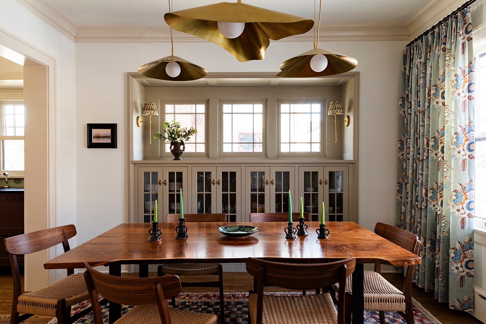 gold pendants over dining table