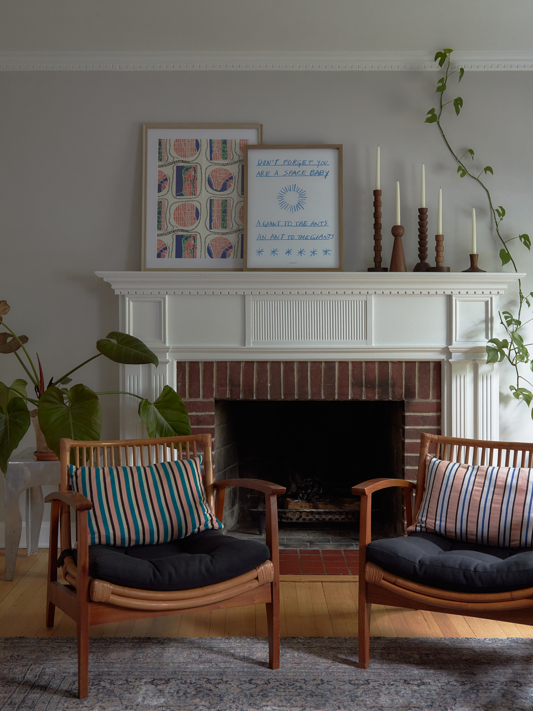 two wood lounge chairs in front of fireplace