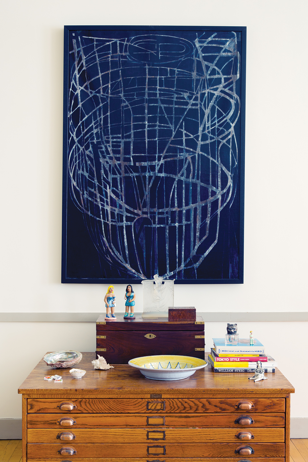 vignette of blue painting and dresser