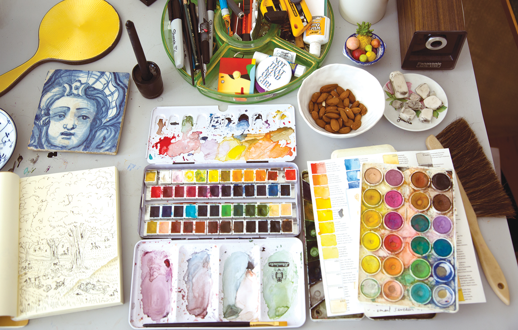overhead shot of dining table with art supplies