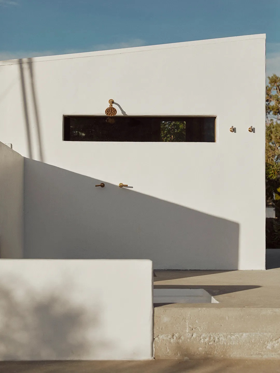 outdoor shower on adobe exterior