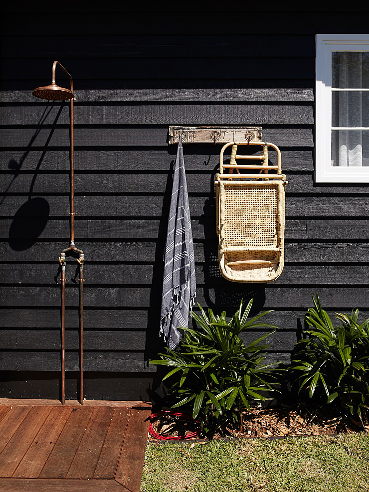 black house exterior with outdoor shower