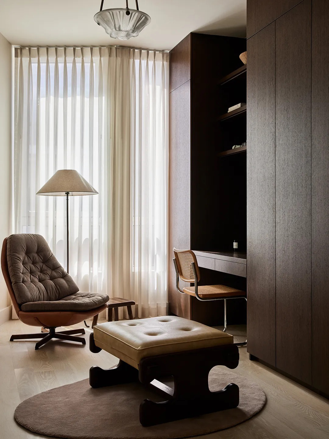 desk surrounded by tall cabinets