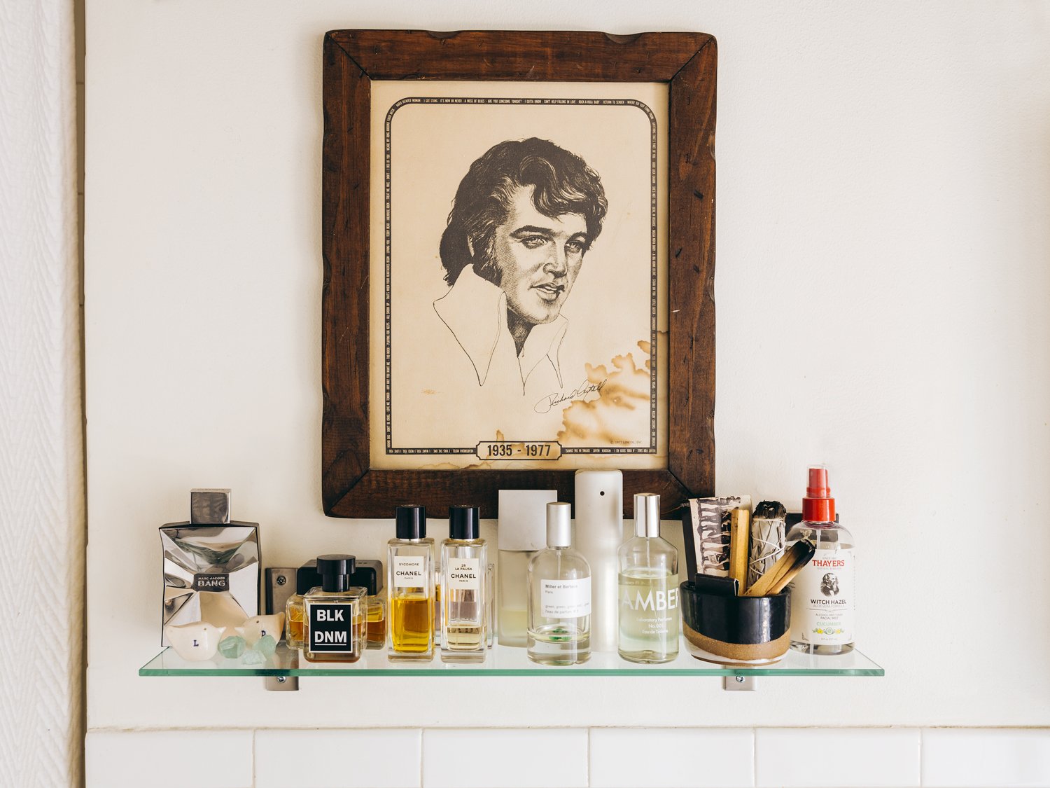 bathroom shelf with elvis portrait