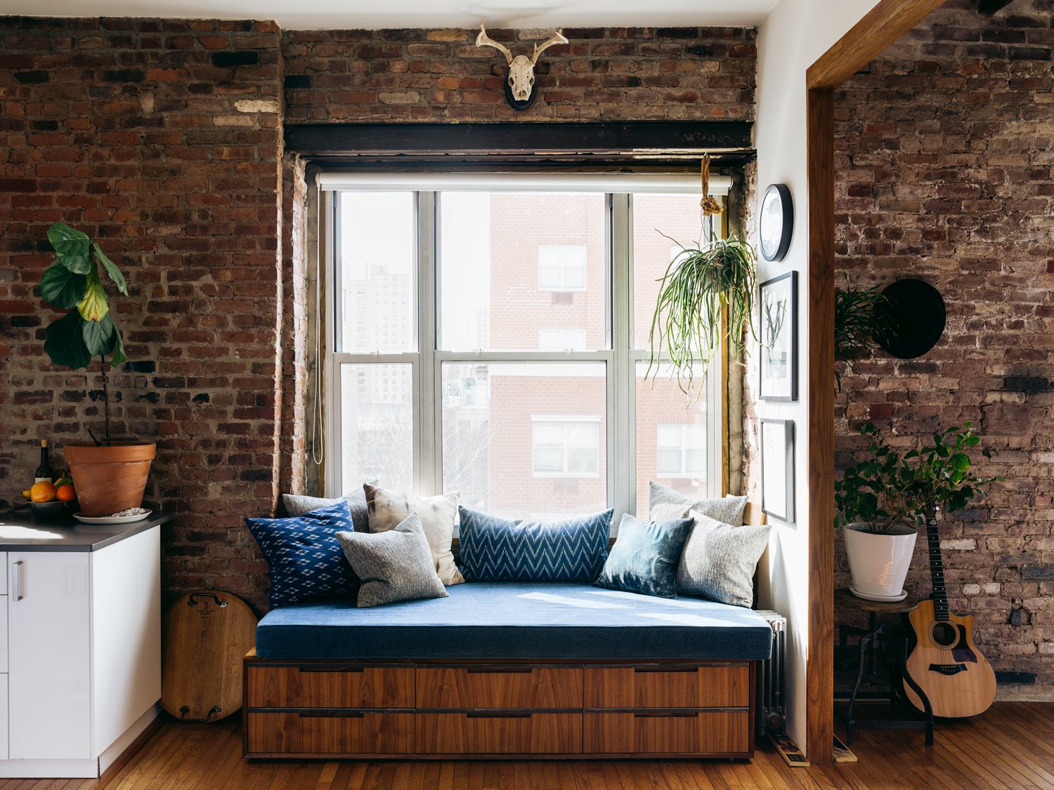 custom made captain's couch with blue pillows