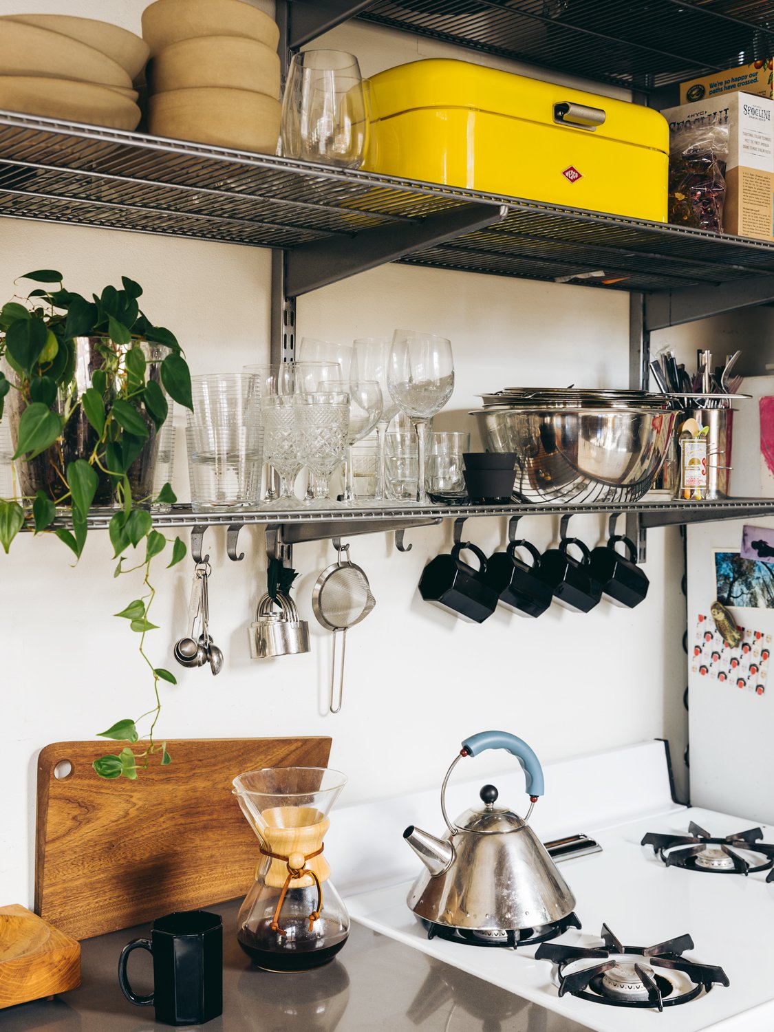 stove, coffee and shelving setup