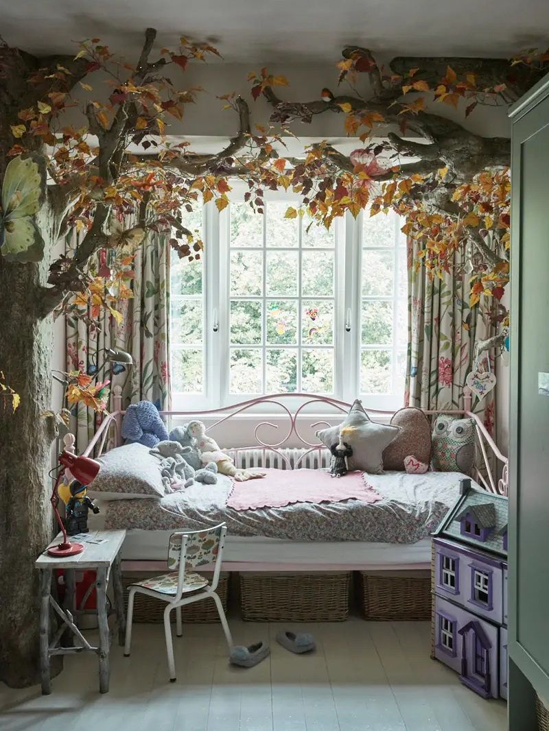 Girl's room with faux forest branches made into a bed canopy.