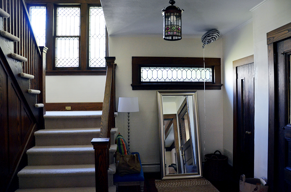 entryway with dark wood trim